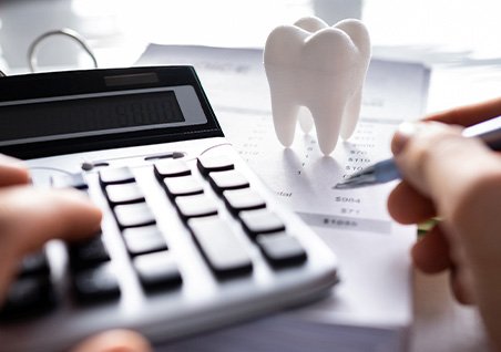 Patient in Bellaire calculating costs for professional teeth whitening treatment