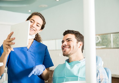 Dentist explains something to patient