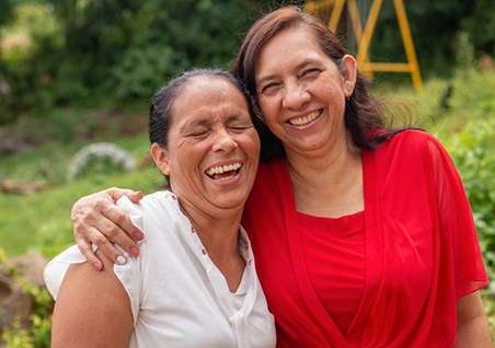Ladies smile outdoors