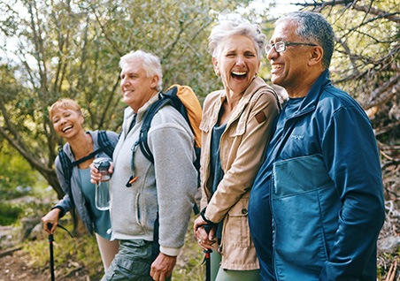 Bellaire dentures patient laughing with friends 