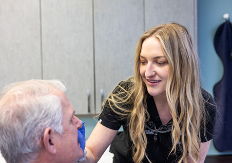 Person filling out dental insurance forms