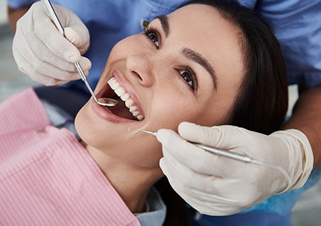 Woman smiling during dental exam