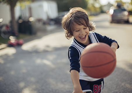 Child dribbling a basketball
